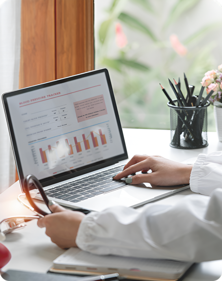 Woman typing on a laptop showing a search traffic growth graph