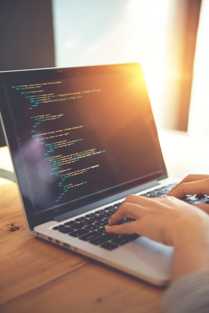 Laptop screen showing website code during a site migration