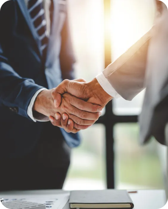Business owner shaking hands with an SEO consultant after a strategy meeting